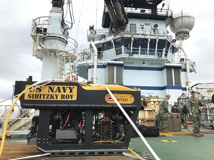 A remotely operated underwater vehicle on the deck of a support ship.